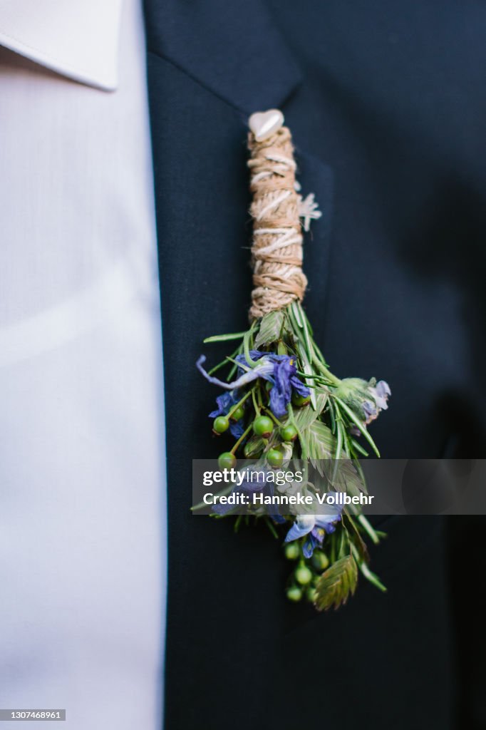 Corsage on suit, hanging upside down