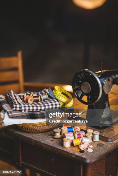 nostalgic sewing machine with fabric and design equipments - thread sewing item stock pictures, royalty-free photos & images