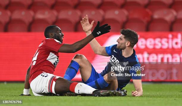 Middlesbrough player Yannick Bolasie and PNE striker Ched Evans shake hands after a challenge during the Sky Bet Championship match between...