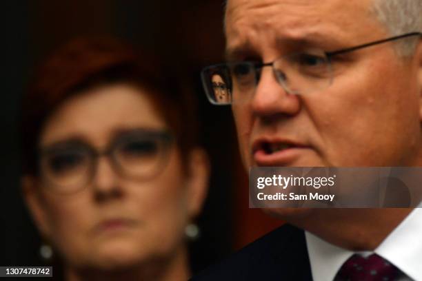 Minister for Foreign Affairs Marise Payne is seen reflected in the glasses of Prime Minister Scott Morrison during a press conference in the Prime...