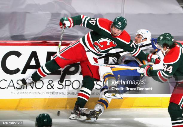 Dmitry Kulikov of the New Jersey Devils steps into Sam Reinhart of the Buffalo Sabres during the second period at the Prudential Center on March 16,...