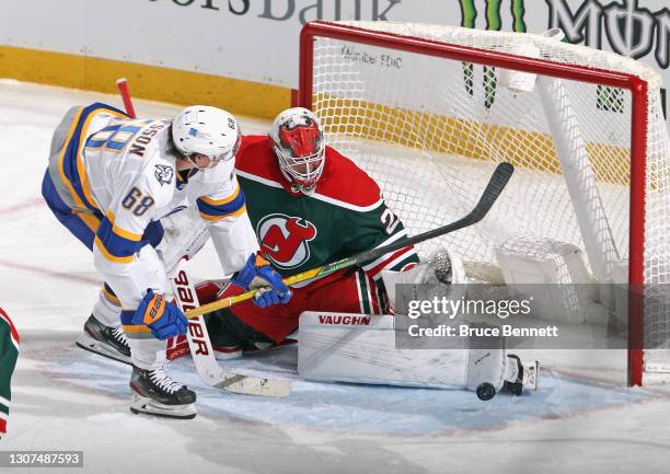 Mackenzie Blackwood of the New Jersey Devils makes the third period save n Victor Olofsson of the Buffalo Sabres at the Prudential Center on March...