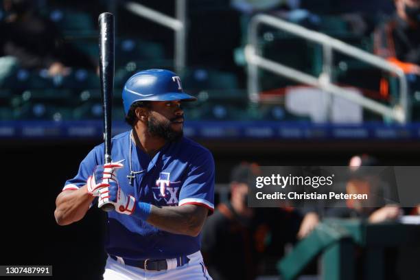 Delino DeShields of the Texas Rangers bats against the San Francisco Giants during the MLB spring training game on March 01, 2021 in Surprise,...