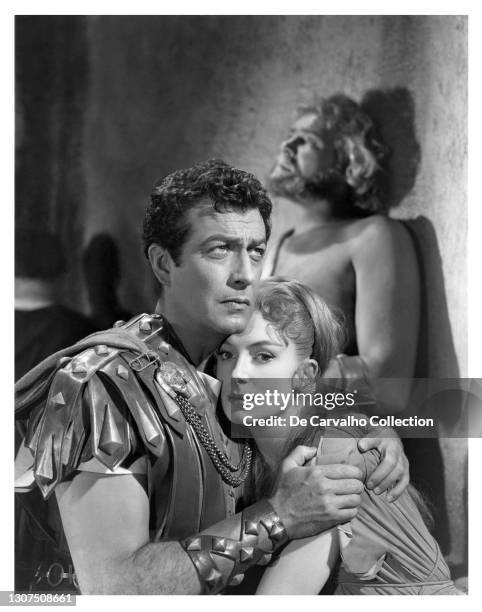 Actor Robert Taylor as the Roman military officer ‘Marcus Vinicius’ holds Actress Deborah Kerr as ‘Lygia’ in a scene from the epic movie 'Quo Vadis'...