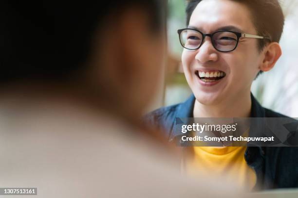 happiness smiling asian male casual meeting with his partner in cafe - korean teen fotografías e imágenes de stock