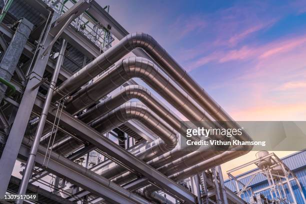 steel pipelines and valves at industrial zone - energy industry heat steam stock pictures, royalty-free photos & images