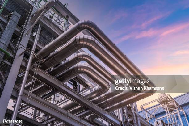 steel pipelines and valves at industrial zone - oil stock pictures, royalty-free photos & images