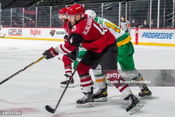 Niklas Hjalmarsson of the Arizona Coyotes passes the puck against the Minnesota Wild during the game at the Xcel Energy Center on March 12, 2021 in...