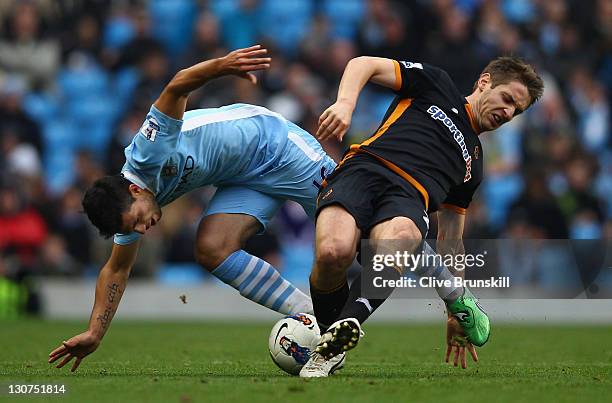 Sergio Aguero of Manchester City in action with Kevin Doyle of Wolverhampton Wanderers during the Barclays Premier League match between Manchester...