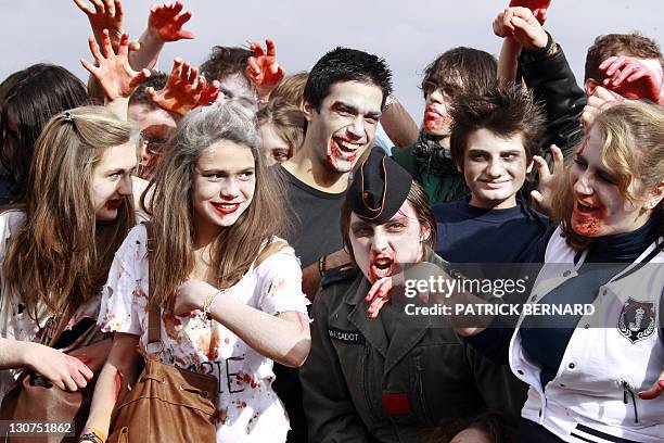 People take part in a Zombie Walk event on October 29, 2011 in Bordeaux, western France, ahead of Halloween which falls every year on October 31....