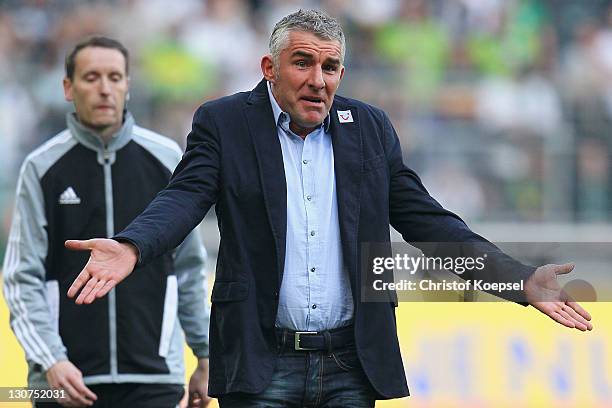 Head coach Mirko Slomka of Hannover looks dejected during the Bundesliga match between Borussia Moenchengladbach and Hannover 96 at Borussia Park...