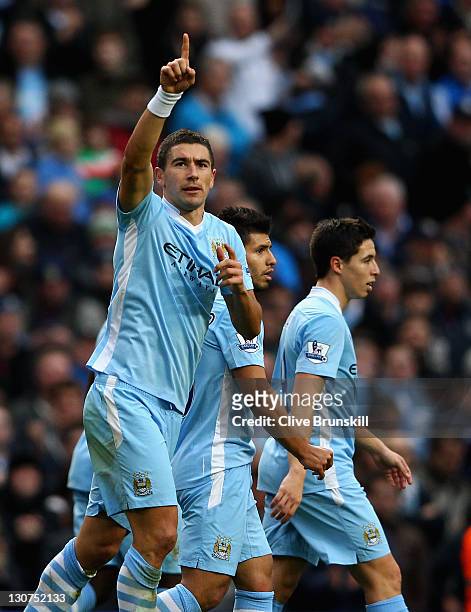 Aleksandar Kolarov of Manchester City celebrates after scoring the second goal during the Barclays Premier League match between Manchester City and...