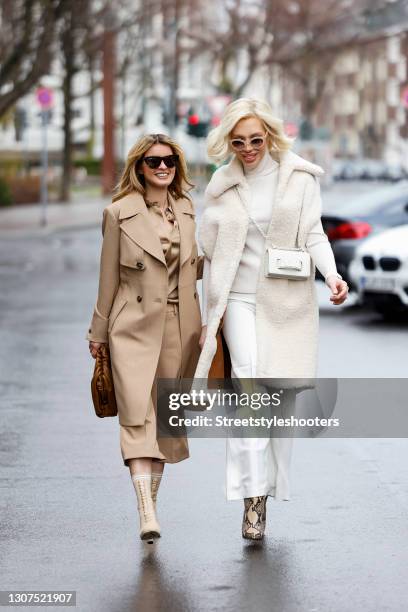 Influencer Gitta Banko wearing beige 7/8 capri pants by Madeleine, a beige silk blouse by Madeleine, a beige coat by Madeleine, beige boots by Fendi,...