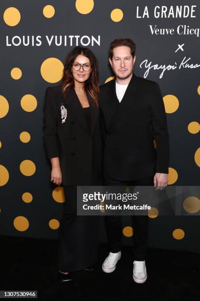 Camilla Freeman-Topper and Marc Freeman arrive at a cocktail event to celebrate Veuve Clicquot's partnership with artist Yayoi Kusama and new vintage...