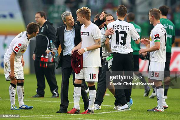 Head coach Lucien Favre and Marco Reus of Moenchengladbach celebrate after winning 2-1 the Bundesliga match between Borussia Moenchengladbach and...