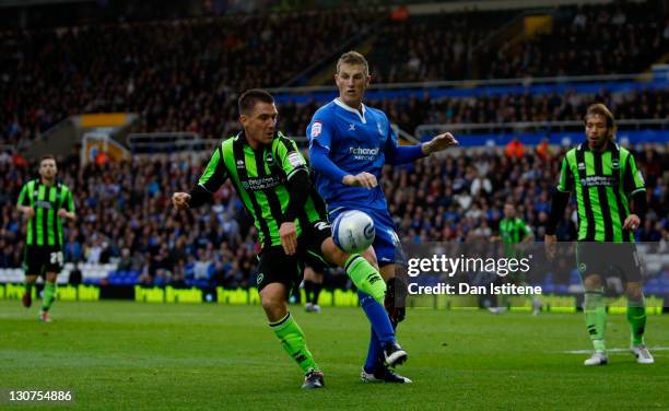 Chris Wood of Birmingham in action against Marcos Painter of Brighton during the npower Championship match between Birmingham City and Brighton &...