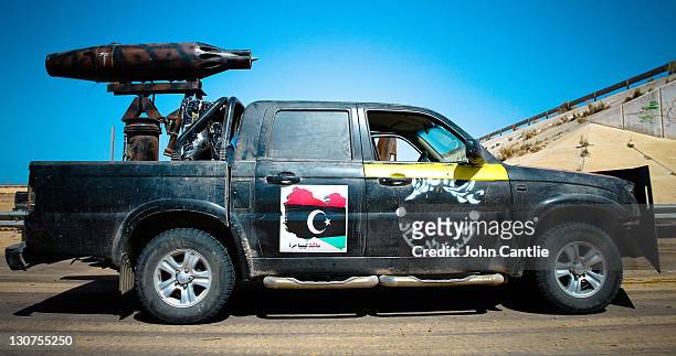 Chinese-made Grand Hiland gun truck stands fitted with 70mm flechette rocket pods taken from an aircraft mounting on September 6, 2011 in Misrata,...