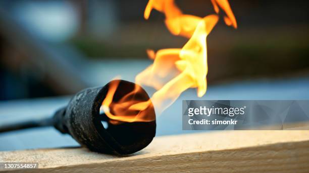 close-up of illuminated blowtorch - blow torch stock pictures, royalty-free photos & images