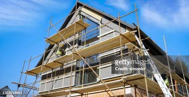 construction worker working at construction site - building activity stock pictures, royalty-free photos & images