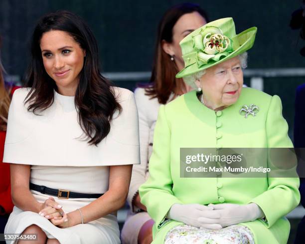 Meghan, Duchess of Sussex and Queen Elizabeth II attend a ceremony to open the new Mersey Gateway Bridge on June 14, 2018 in Widnes, England. Meghan...