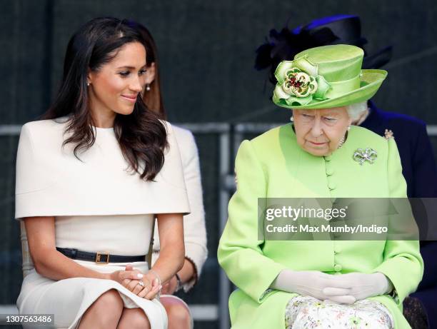 Meghan, Duchess of Sussex and Queen Elizabeth II attend a ceremony to open the new Mersey Gateway Bridge on June 14, 2018 in Widnes, England. Meghan...