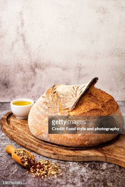 homemade sourdough bread with olive oil and zaatar - pane a lievito naturale foto e immagini stock