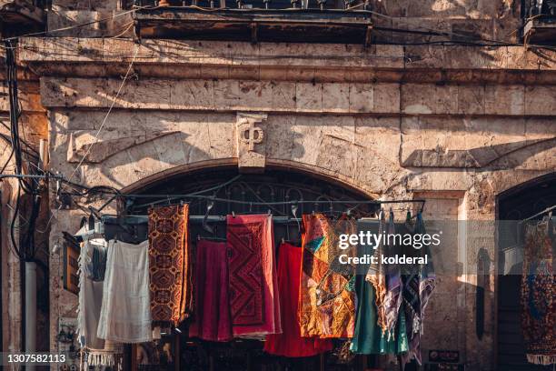 traditional scarves for sale in jerusalem old city - palestinian clothes stock pictures, royalty-free photos & images