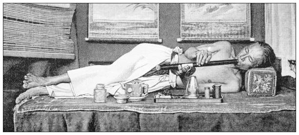 antique black and white photograph: chinese opium den - opium smoker stock illustrations