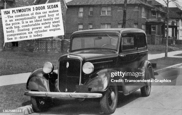 Picture postcard advertises a used 1934 Plymouth two-door Sedan, 1930s or 1940s.