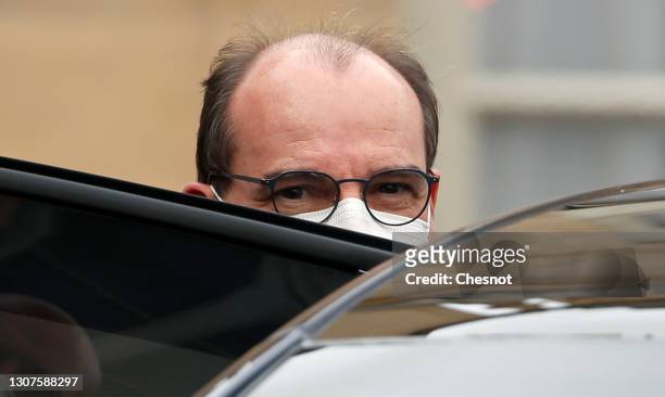 French Prime Minister Jean Castex wearing a protective face mask leaves the Elysee Palace following the weekly council meeting on 17, March 2021 in...