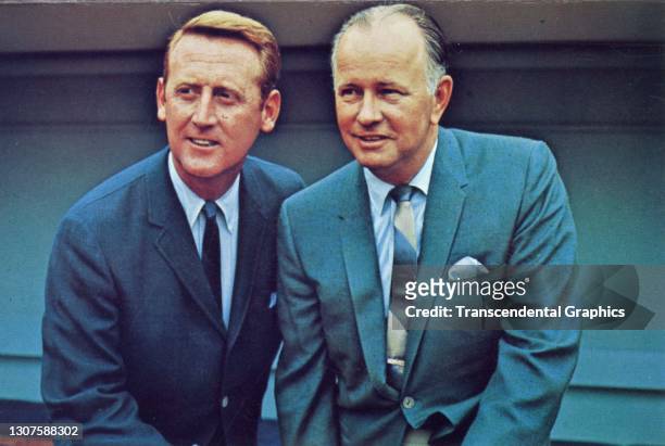 Portrait of American sportscasters Vin Scully and Jerry Doggett as they pose together in Dodger Stadium, Los Angeles, 1960.
