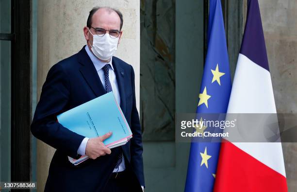 French Prime Minister Jean Castex wearing a protective face mask leaves the Elysee Palace following the weekly council meeting on 17, March 2021 in...