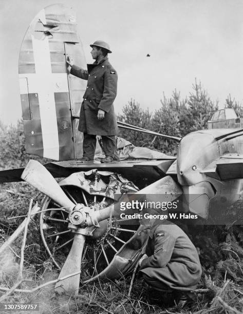 Royal Air Force personnel inspect the wreckage of a Regia Aeronautica Fiat BR20 Cicogna twin engine medium bomber from 243 Squadriglia of 99 Gruppo...