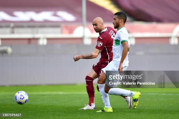 Simone Zaza of Torino F.C. Scores his sides first goal while under pressure from Jeremy Toljan of Sassuolo during the Serie A match between Torino FC...