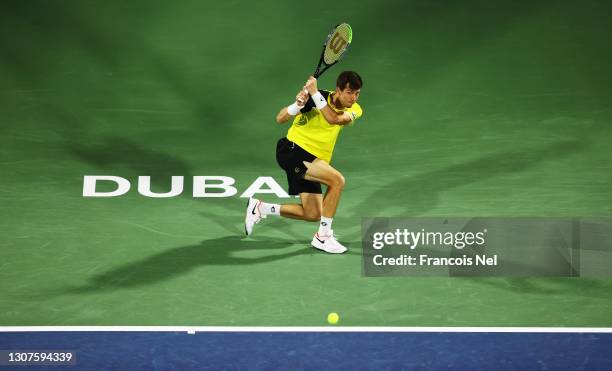 Aljaz Bedene of Slovenia hits a backhand during the round of 16 match between Aljaz Bedene of Slovenia and Kei Nishikori of Japan during Day Eleven...