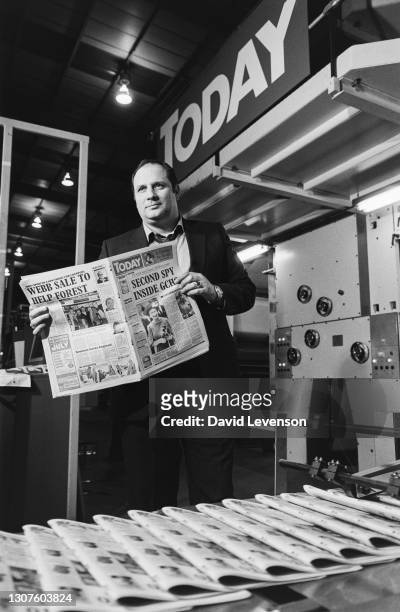 Eddy Shah, watches the first copies of his new newspaper, "Today" coming off the presses, at his print works near Heathrow on March 4, 1986.
