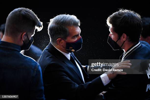 New FC Barcelona President Joan Laporta speaks to Gerard Pique and Sergio Roberto of FC Barcelona during the FC Barcelona President official...