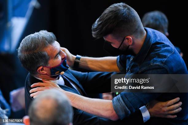 New FC Barcelona President Joan Laporta speaks to Gerard Pique of FC Barcelona during the FC Barcelona President official inaguration at Camp Nou on...