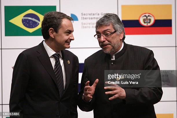Paraguayan President Fernando Lugo gestures next to Spanish President of Goverment Jose Luis Rodriguez Zapatero before the group picture of the XXI...