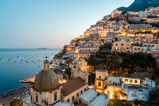positano at dusk, amalfi coast, italy - italy stock pictures, royalty-free photos & images