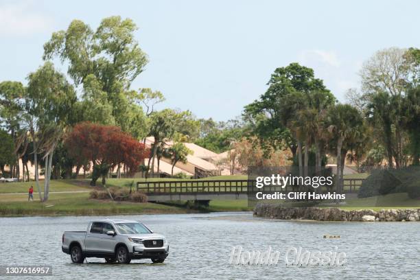 General view of signage and a truck displayed on the lake next on the 18th hole during the pro-am prior to The Honda Classic on March 17, 2021 in...