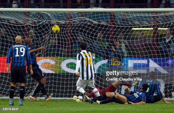 Mirko Vucinic of FC Juventus scores the first goal during the Serie A match between FC Internazionale Milano and Juventus FC at Stadio Giuseppe...