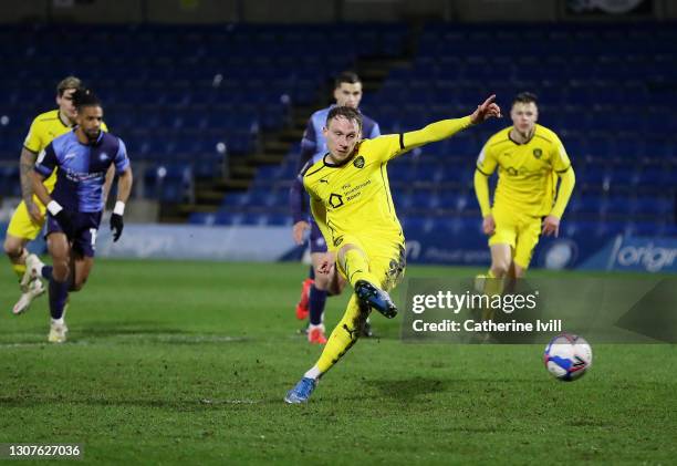 Cauley Woodrow of Barnsley FC scores their team's first goal from the penalty spot during the Sky Bet Championship match between Wycombe Wanderers...