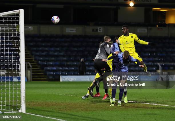 Daryl Dike of Barnsley FC scores their team's second goal past David Stockdale of Wycombe Wanderers during the Sky Bet Championship match between...