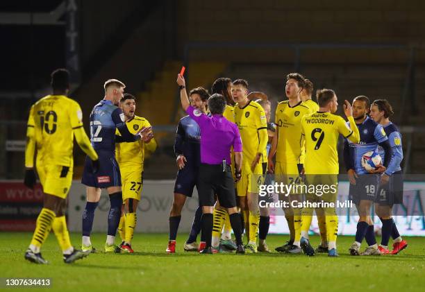 Alex Mowatt of Barnsley FC is shown a red card and sent off by Match Referee, Darren Bond during the Sky Bet Championship match between Wycombe...