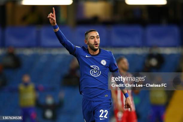 Hakim Ziyech of Chelsea celebrates after scoring their team's first goal during the UEFA Champions League Round of 16 match between Chelsea FC and...
