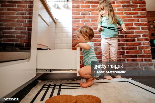 kids playing at home in kitchen - drawer stock pictures, royalty-free photos & images
