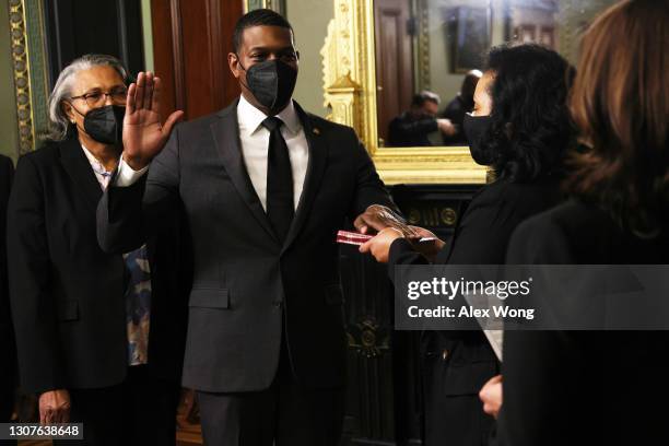 Michael Regan is sworn in as EPA Administrator by U.S. Vice President Kamala Harris as his wife Melvina Regan , and mother Mavis Regan look on in the...