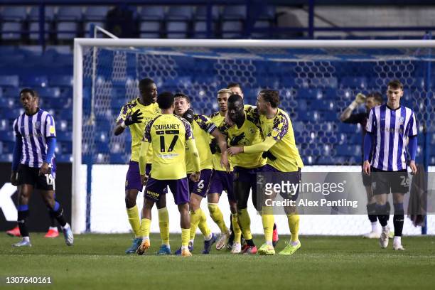 Huddersfield Town players celebrate their first goal, an own goal by Callum Paterson of Sheffield Wednesday during the Sky Bet Championship match...