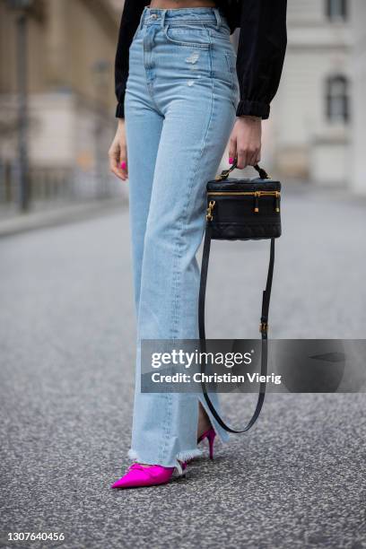 Mandy Bork is seen wearing black Zara jeans and cropped jacket, Balenciaga heels, Linda Farrow sunglasses, Dior bag on March 16, 2021 in Berlin,...